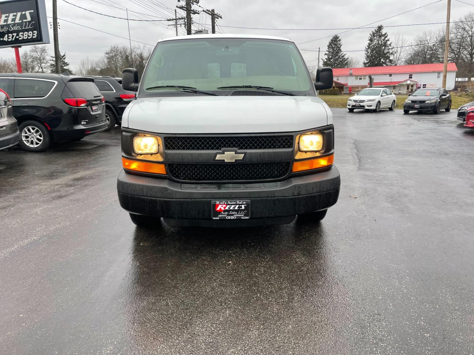 2014 White /Neutral Chevrolet Express 1500 AWD Cargo (1GCSHAF4XE1) with an 5.3L V8 OHV 16V FFV engine, 4-Speed Automatic transmission, located at 547 E. Main St., Orwell, OH, 44076, (440) 437-5893, 41.535435, -80.847855 - This 2014 Chevrolet Express 1500 Cargo Van with a 5.3L Vortec V8 engine and all-wheel drive is a versatile and robust vehicle designed to meet various transportation and towing needs. It comes equipped with convenient features such as power windows, power locks, and a backup camera for safer reversi - Photo #1